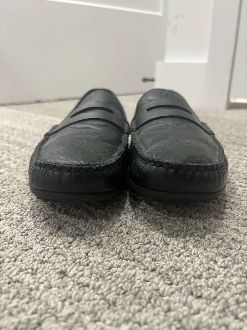 Gucci Black GG Embossed Leather Penny Loafers